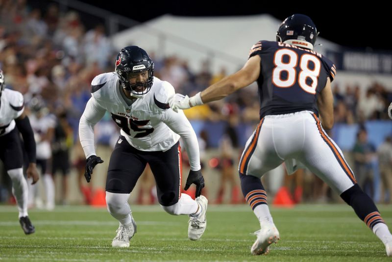 Houston Texans defensive end Derek Barnett (95) attempts to run past Chicago Bears tight end Stephen Carlson (88) during an NFL preseason football game, Thursday Aug. 21, 2024, in Canton, Ohio. (AP Photo/Kirk Irwin)