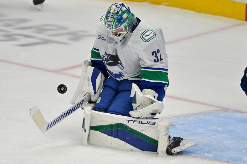 Nov 5, 2024; Anaheim, California, USA; Vancouver Canucks goaltender Kevin Lankinen (32) makes a save in the first period against the Anaheim Ducks at Honda Center. Mandatory Credit: Jayne Kamin-Oncea-Imagn Images