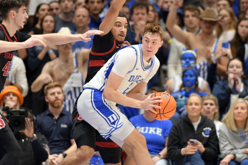 Feb 15, 2025; Durham, North Carolina, USA;  Duke Blue Devils forward Cooper Flagg (2) moves towards the basket against Stanford Cardinal forward Donavin Young (2) during the first half at Cameron Indoor Stadium. Mandatory Credit: Zachary Taft-Imagn Images