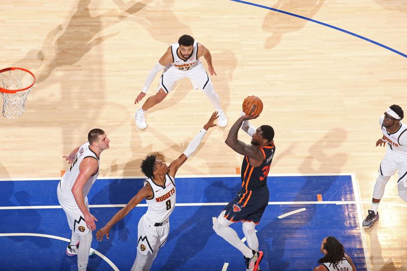 NEW YORK, NY - JANUARY 25: Julius Randle #30 of the New York Knicks shoots the ball during the game against the Denver Nuggets on January 25, 2024 at Madison Square Garden in New York City, New York.  NOTE TO USER: User expressly acknowledges and agrees that, by downloading and or using this photograph, User is consenting to the terms and conditions of the Getty Images License Agreement. Mandatory Copyright Notice: Copyright 2024 NBAE  (Photo by Nathaniel S. Butler/NBAE via Getty Images)