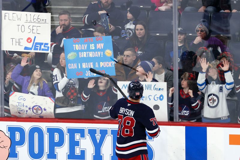 Mar 14, 2026; Winnipeg, Manitoba, CAN; Winnipeg Jets defenseman Jacob Bryson (78) tosses a puck to a fan before a game against the Colorado Avalanche at Canada Life Centre. Mandatory Credit: James Carey Lauder-Imagn Images Mar 14, 2026; Winnipeg, Manitoba, CAN; Winnipeg Jets defenseman Jacob Bryson (78) tosses a puck to a fan before a game against the Colorado Avalanche at Canada Life Centre. Mandatory Credit: James Carey Lauder-Imagn Images