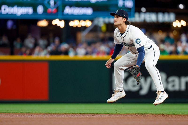 May 31, 2025; Seattle, Washington, USA; Seattle Mariners second baseman Cole Young (2) reacts to a pitch against the Minnesota Twins during the first inning at T-Mobile Park. Mandatory Credit: Joe Nicholson-Imagn Images