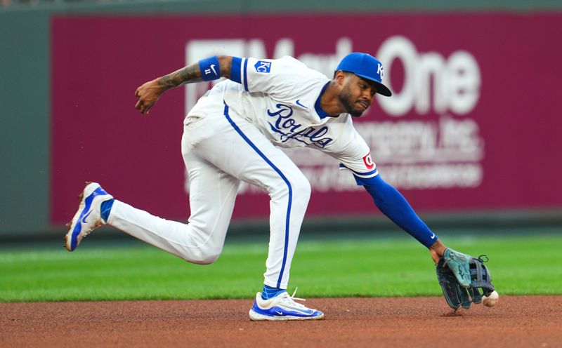 Aug 24, 2024; Kansas City, Missouri, USA; Kansas City Royals third baseman Maikel Garcia (11) is unable to make the stop during the fourth inning against the Philadelphia Phillies at Kauffman Stadium. Mandatory Credit: Jay Biggerstaff-USA TODAY Sports