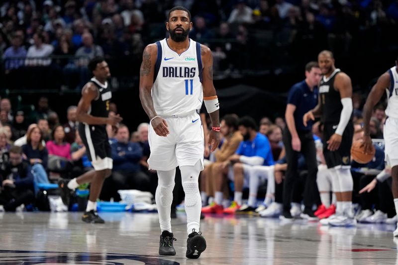 DALLAS, TEXAS - JANUARY 09: Kyrie Irving #11 of the Dallas Mavericks walks up the court during the second half against the Memphis Grizzlies at American Airlines Center on January 09, 2024 in Dallas, Texas. NOTE TO USER: User expressly acknowledges and agrees that, by downloading and or using this photograph, User is consenting to the terms and conditions of the Getty Images License Agreement. (Photo by Sam Hodde/Getty Images)