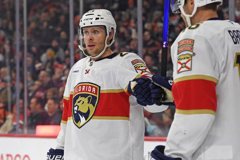 Dec 5, 2024; Philadelphia, Pennsylvania, USA; Florida Panthers center Carter Verhaeghe (23) celebrates his goal with center Aleksander Barkov (16) against the Philadelphia Flyers during the second period at Wells Fargo Center. Mandatory Credit: Eric Hartline-Imagn Images