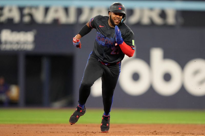 Sep 9, 2024; Toronto, Ontario, CAN; Toronto Blue Jays designated hitter Vladimir Guerrero Jr. (27) runs to third on a double hit by first baseman Spencer Horwitz (not pictured) against the New York Mets during the first inning at Rogers Centre. Mandatory Credit: John E. Sokolowski-Imagn Images