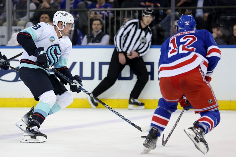 Jan 16, 2024; New York, New York, USA; Seattle Kraken defenseman Brian Dumoulin (8) skates with the puck against New York Rangers center Nick Bonino (12) during the second period at Madison Square Garden. Mandatory Credit: Brad Penner-USA TODAY Sports