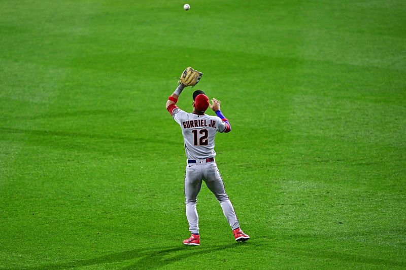 Oct 23, 2023; Philadelphia, Pennsylvania, USA; Arizona Diamondbacks left fielder Lourdes Gurriel Jr. (12) catches a fly ball during the ninth inning against the Philadelphia Phillies in game six of the NLCS for the 2023 MLB playoffs at Citizens Bank Park. Mandatory Credit: Kyle Ross-USA TODAY Sports