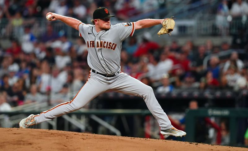 Aug 19, 2023; Cumberland, Georgia, USA; San Francisco Giants starting pitcher Logan Webb (62) pitching against the Atlanta Braves during the fourth inning at Truist Park. Mandatory Credit: John David Mercer-USA TODAY Sports