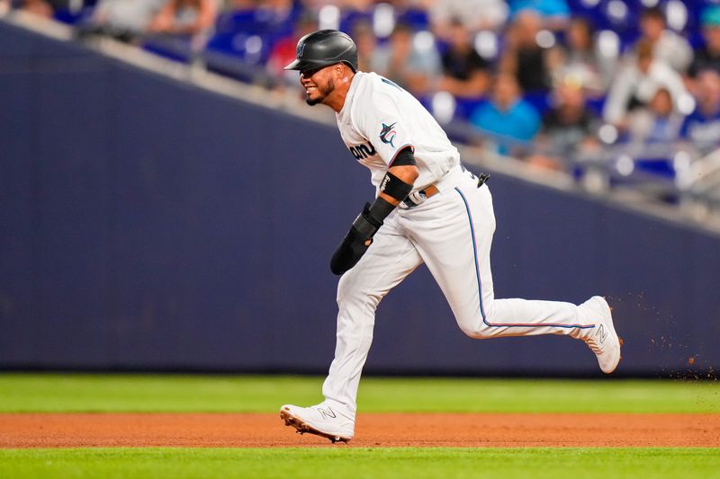 Jun 20, 2023; Miami, Florida, USA; Miami Marlins second baseman Luis Arraez (3) attempts to run to second base against the Toronto Blue Jays during the fourth inning at loanDepot Park. Mandatory Credit: Rich Storry-USA TODAY Sports