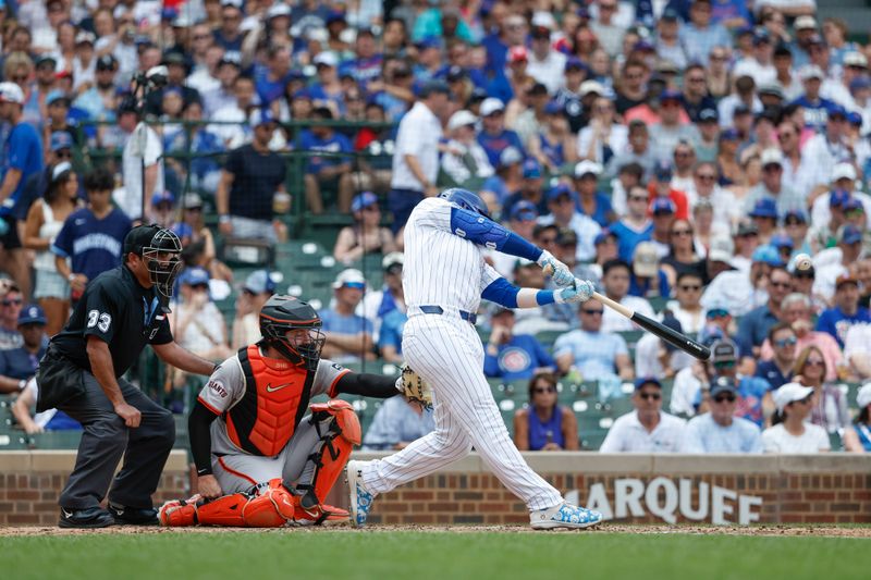 Jun 19, 2024; Chicago, Illinois, USA; Chicago Cubs outfielder Ian Happ (8) hits a solo home run against the San Francisco Giants during the fourth inning at Wrigley Field. Mandatory Credit: Kamil Krzaczynski-USA TODAY Sports