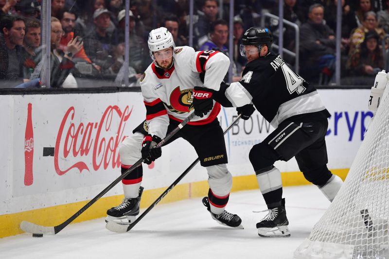Nov 24, 2025; Los Angeles, California, USA; Los Angeles Kings defenseman Mikey Anderson (44) plays for the puck against Ottawa Senators right wing Drake Batherson (19) during the third period at Crypto.com Arena. Mandatory Credit: Gary A. Vasquez-Imagn Images