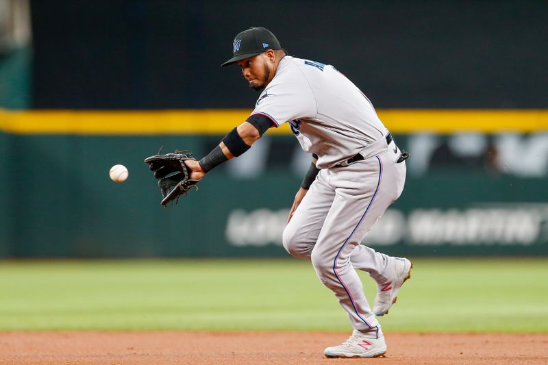 Aug 6, 2023; Arlington, Texas, USA; Miami Marlins second baseman Luis Arraez (3) fields a ground ball during the first inning against the Texas Rangers at Globe Life Field. Mandatory Credit: Andrew Dieb-USA TODAY Sports