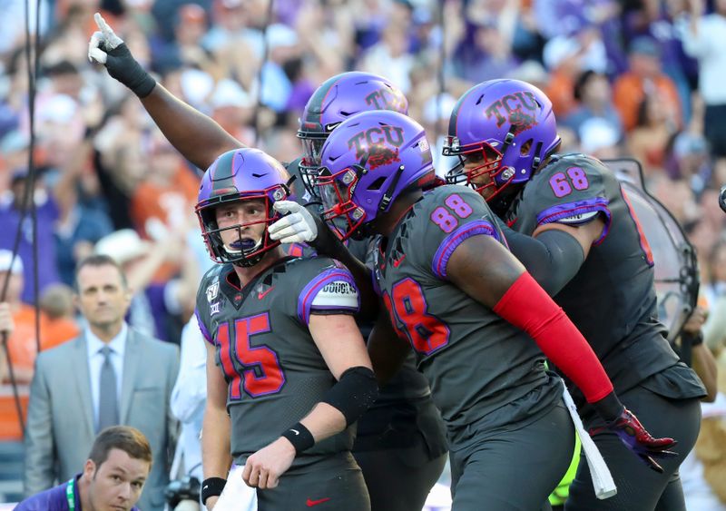 Oct 26, 2019; Fort Worth, TX, USA; TCU Horned Frogs quarterback Max Duggan (15) celebrates with teammates after scoring a touchdown during the fourth quarter against the Texas Longhorns at Amon G. Carter Stadium. Mandatory Credit: Kevin Jairaj-USA TODAY Sports