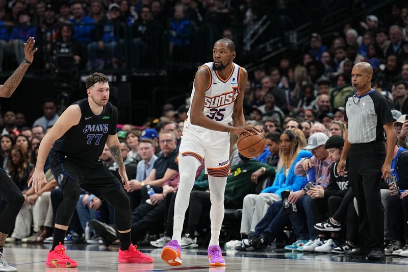 DALLAS, TX - JANUARY 24: Kevin Durant #35 of the Phoenix Suns handles the ball against defender Luka Doncic #77 of the Dallas Mavericks during the game on January 24, 2024 at the American Airlines Center in Dallas, Texas. NOTE TO USER: User expressly acknowledges and agrees that, by downloading and or using this photograph, User is consenting to the terms and conditions of the Getty Images License Agreement. Mandatory Copyright Notice: Copyright 2024 NBAE (Photo by Glenn James/NBAE via Getty Images)