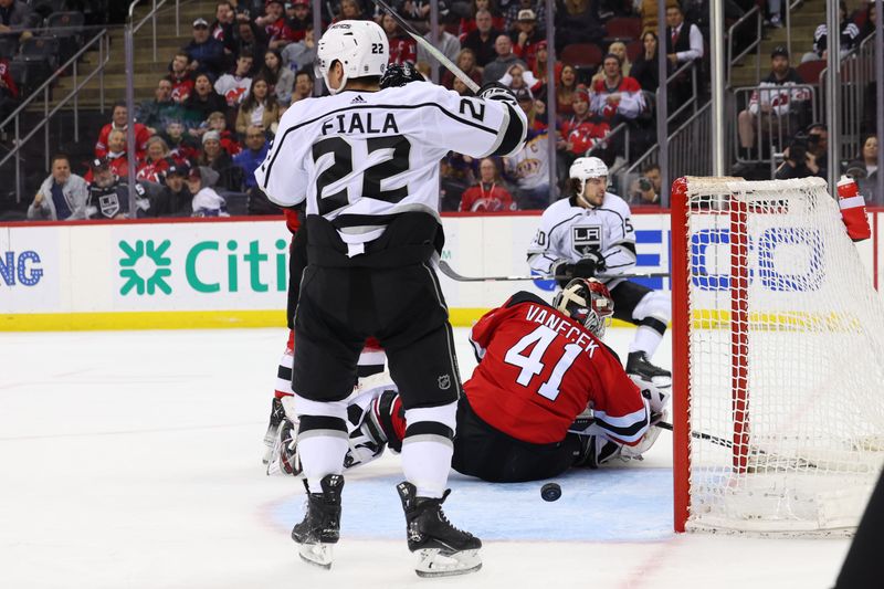 Feb 23, 2023; Newark, New Jersey, USA; Los Angeles Kings defenseman Sean Durzi (50) scores a goal on New Jersey Devils goaltender Vitek Vanecek (41) during the third period at Prudential Center. Mandatory Credit: Ed Mulholland-USA TODAY Sports