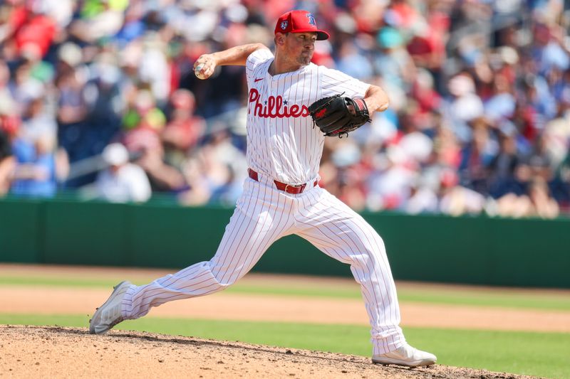 Mar 14, 2024; Clearwater, Florida, USA;  Philadelphia Phillies pitcher Andrew Bellatti (64) throws a pitch against the Boston Red Sox in the seventh inning at BayCare Ballpark. Mandatory Credit: Nathan Ray Seebeck-USA TODAY Sports