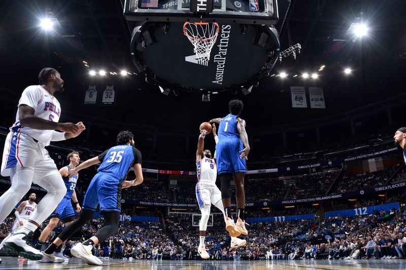 ORLANDO, FL - NOVEMBER 15: Paul George #8 of the Philadelphia 76ers shoots the ball during the game against the Orlando Magic during the Emirates NBA Cup game on  November 15, 2024 at Kia Center in Orlando, Florida. NOTE TO USER: User expressly acknowledges and agrees that, by downloading and or using this photograph, User is consenting to the terms and conditions of the Getty Images License Agreement. Mandatory Copyright Notice: Copyright 2024 NBAE (Photo by Fernando Medina/NBAE via Getty Images)