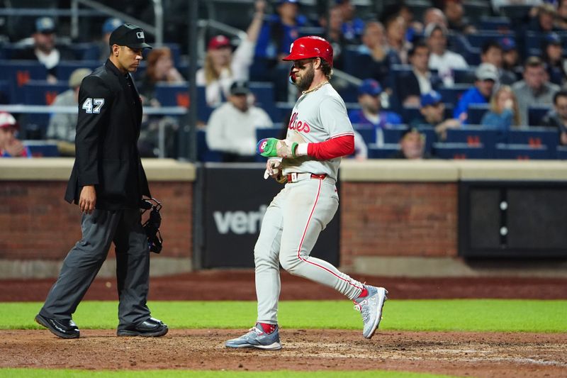 May 13, 2024; New York City, New York, USA; Philadelphia Phillies first baseman Bryce Harper (3) scores a run on Philadelphia Phillies second baseman Bryson Stott (not pictured) sacrifice fly ball against the New York Mets during the tenth inning at Citi Field. Mandatory Credit: Gregory Fisher-USA TODAY Sports