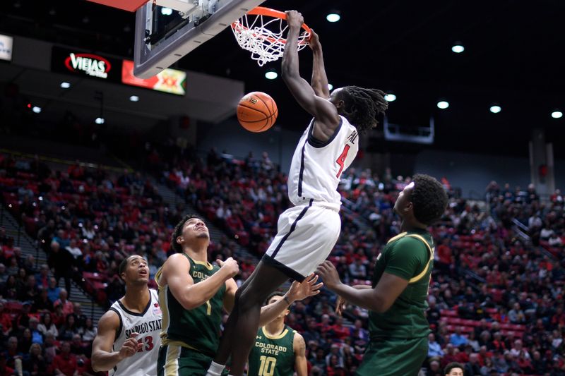 Feb 13, 2024; San Diego, California, USA; San Diego State Aztecs forward Jay Pal (4) dunks the ball during the first half against the Colorado State Rams at Viejas Arena. Mandatory Credit: Orlando Ramirez-USA TODAY Sports