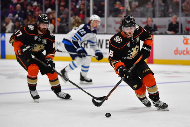 Jan 5, 2024; Anaheim, California, USA; Anaheim Ducks defenseman Jamie Drysdale (6) moves the puck against the Winnipeg Jets during the second period at Honda Center. Mandatory Credit: Gary A. Vasquez-USA TODAY Sports