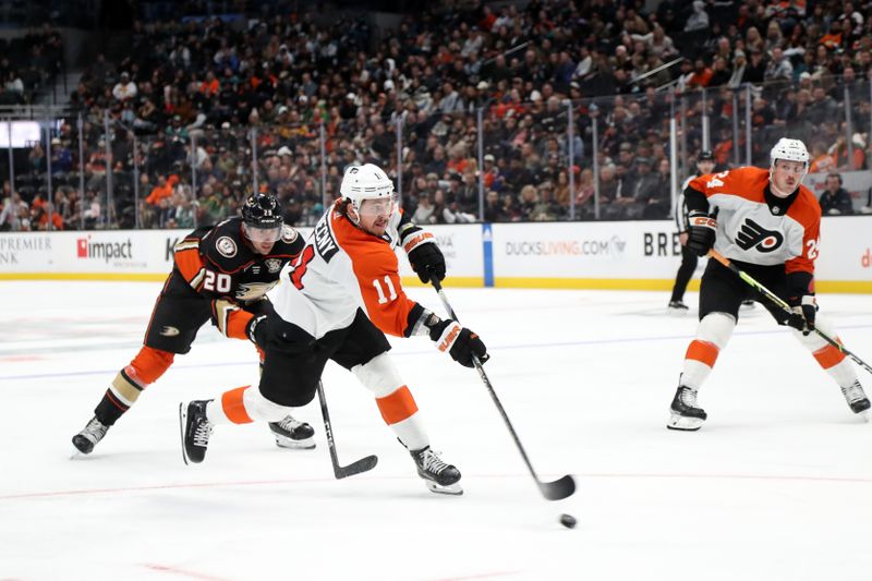 Nov 10, 2023; Anaheim, California, USA; Philadelphia Flyers right wing Travis Konecny (11) shoots the puck during the third period against the Anaheim Ducks at Honda Center. Mandatory Credit: Kiyoshi Mio-USA TODAY Sports