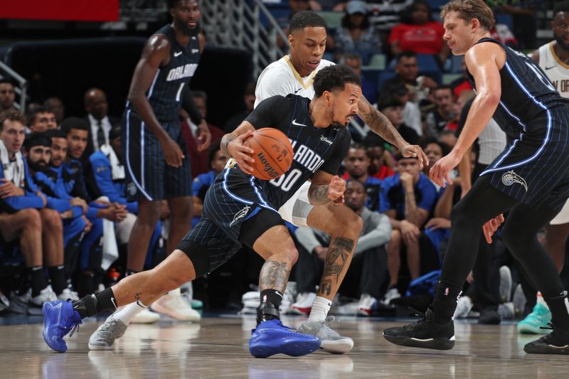 NEW ORLEANS, LA - OCTOBER 7: Cole Anthony #50 of the Orlando Magic drives to the basket during the game against the New Orleans Pelicans on October 7, 2024 at the Smoothie King Center in New Orleans, Louisiana. NOTE TO USER: User expressly acknowledges and agrees that, by downloading and or using this Photograph, user is consenting to the terms and conditions of the Getty Images License Agreement. Mandatory Copyright Notice: Copyright 2024 NBAE (Photo by Layne Murdoch Jr./NBAE via Getty Images)