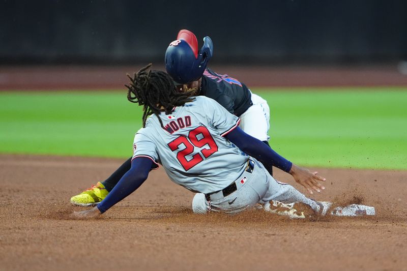 Jul 10, 2024; New York City, New York, USA; Washington Nationals left fielder James Wood (29) is tagged out by New York Mets shortstop Francisco Lindor (12) attempting to steal second base during the fifth inning at Citi Field. Mandatory Credit: Gregory Fisher-USA TODAY Sports