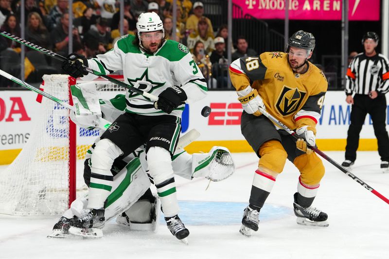 Apr 29, 2024; Las Vegas, Nevada, USA; Dallas Stars defenseman Chris Tanev (3) and Vegas Golden Knights center Tomas Hertl (48) eye a loose puck during the first period of game four of the first round of the 2024 Stanley Cup Playoffs at T-Mobile Arena. Mandatory Credit: Stephen R. Sylvanie-USA TODAY Sports