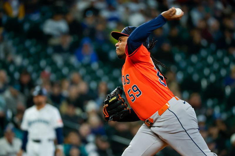 Apr 8, 2025; Seattle, Washington, USA; Houston Astros starting pitcher Framber Valdez (59) throws against the Seattle Mariners during the first inning at T-Mobile Park. Mandatory Credit: Joe Nicholson-Imagn Images