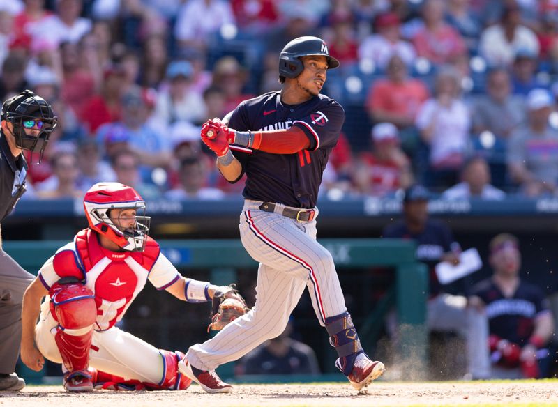 Aug 13, 2023; Philadelphia, Pennsylvania, USA; Minnesota Twins second baseman Jorge Polanco (11) hits an RBI single during the ninth inning against the Philadelphia Phillies at Citizens Bank Park. Mandatory Credit: Bill Streicher-USA TODAY Sports