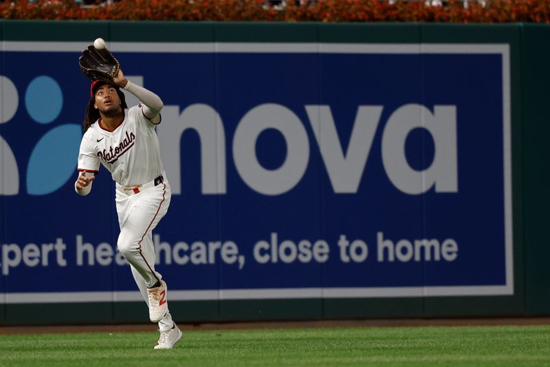 Sep 12, 2024; Washington, District of Columbia, USA; Washington Nationals outfielder James Wood (29) catches a fly ball by Miami Marlins outfielder Kyle Stowers (not pictured) during the eighth inning at Nationals Park. Mandatory Credit: Geoff Burke-Imagn Images