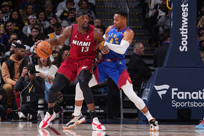 DENVER, CO - NOVEMBER 8: Bam Adebayo #13 of the Miami Heat dribbles the ball during the game against the Denver Nuggets on November 8, 2024 at Ball Arena in Denver, Colorado. NOTE TO USER: User expressly acknowledges and agrees that, by downloading and/or using this Photograph, user is consenting to the terms and conditions of the Getty Images License Agreement. Mandatory Copyright Notice: Copyright 2024 NBAE (Photo by Bart Young/NBAE via Getty Images)