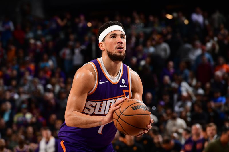 PHOENIX, AZ - FEBRUARY 13:  Devin Booker #1 of the Phoenix Suns shoots a free throw during the game against the Sacramento Kings on February 13, 2024 at Footprint Center in Phoenix, Arizona. NOTE TO USER: User expressly acknowledges and agrees that, by downloading and or using this photograph, user is consenting to the terms and conditions of the Getty Images License Agreement. Mandatory Copyright Notice: Copyright 2024 NBAE (Photo by Kate Frese/NBAE via Getty Images)