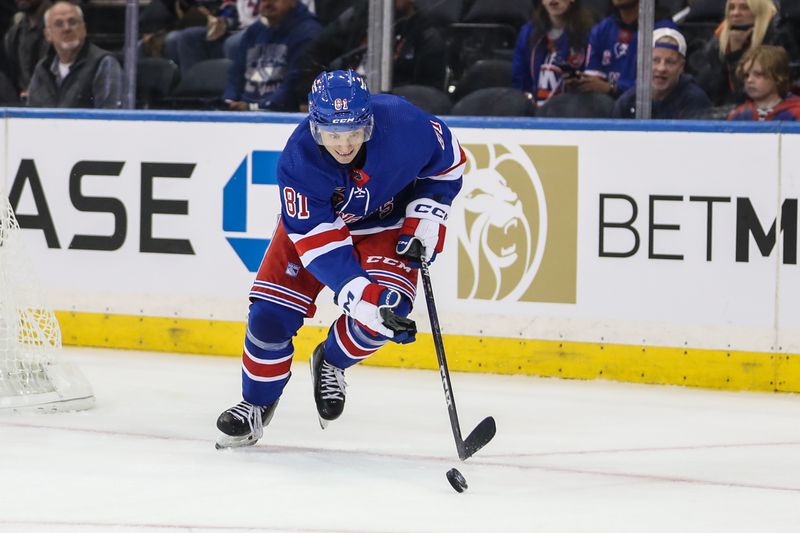 Sep 26, 2023; New York, New York, USA;  New York Rangers defenseman Mac Hollowell (81) chases the puck in the second period against the New York Islanders at Madison Square Garden. Mandatory Credit: Wendell Cruz-USA TODAY Sports