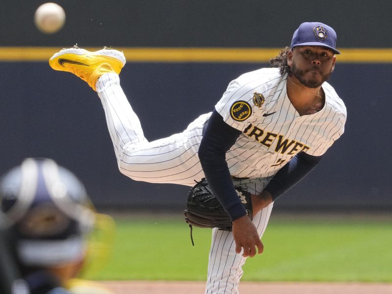 Jun 8, 2025; Milwaukee, Wisconsin, USA; Milwaukee Brewers pitcher Freddy Peralta (51) delivers a pitch against the San Diego Padres in the first inning at American Family Field. Mandatory Credit: Michael McLoone-Imagn Images