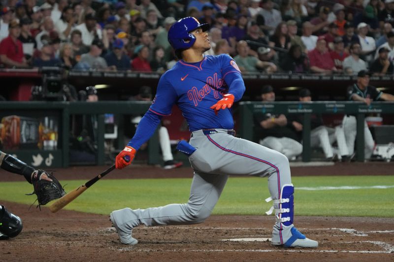 May 7, 2025; Phoenix, Arizona, USA; New York Mets outfielder Juan Soto (22) hits a solo home run against the Arizona Diamondbacks in the sixth inning at Chase Field. Mandatory Credit: Rick Scuteri-Imagn Images