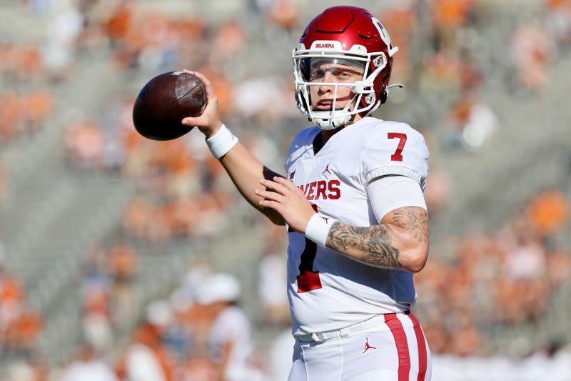 Oct 9, 2021; Dallas, Texas, USA; Oklahoma Sooners quarterback Spencer Rattler (7) warms up before the game against the Texas Longhorns at the Cotton Bowl. Mandatory Credit: Kevin Jairaj-USA TODAY Sports