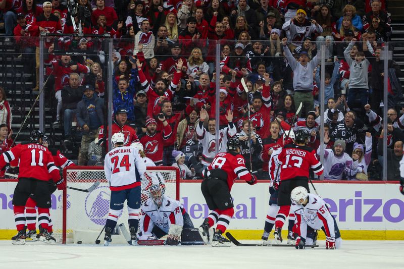 Nov 30, 2024; Newark, New Jersey, USA; The fans react the New Jersey Devils center Nico Hischier (13) goal against the Washington Capitals during the first period at Prudential Center. Mandatory Credit: Thomas Salus-Imagn Images