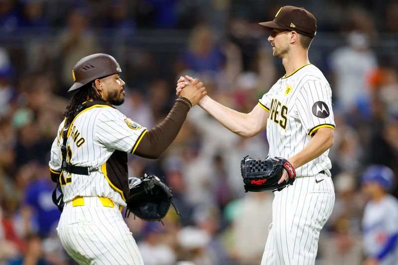 Jul 31, 2024; San Diego, California, USA; San Diego Padres catcher Luis Campusano (12) celebrates with relief pitcher Bryan Hoeing (78) after the final out of the game against the Los Angeles Dodgers at Petco Park. Mandatory Credit: David Frerker-USA TODAY Sports