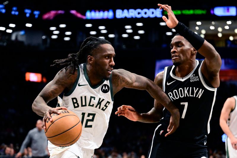 NEW YORK, NEW YORK - DECEMBER 08:  Taurean Prince #12 of the Milwaukee Bucks is defended by Shake Milton #7 of the Brooklyn Nets \d1h at Barclays Center on December 08, 2024 in New York City. NOTE TO USER: User expressly acknowledges and agrees that, by downloading and or using this Photograph, user is consenting to the terms and conditions of the Getty Images License Agreement.  (Photo by Steven Ryan/Getty Images)