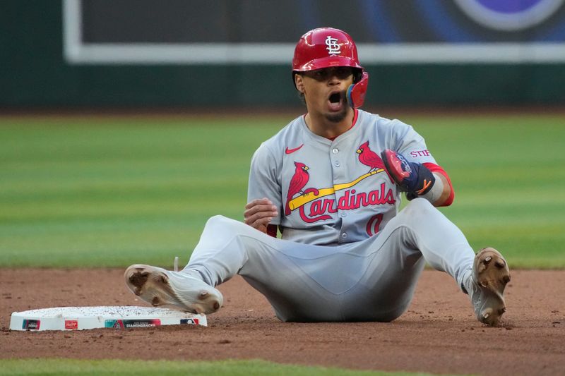 Apr 13, 2024; Phoenix, Arizona, USA; St. Louis Cardinals shortstop Masyn Winn (0) reacts after being called out trying to steal secondbase against the Arizona Diamondbacks in the fifth inning at Chase Field. The play was reversed after a successful challenge by the Cardinals. Mandatory Credit: Rick Scuteri-USA TODAY Sports