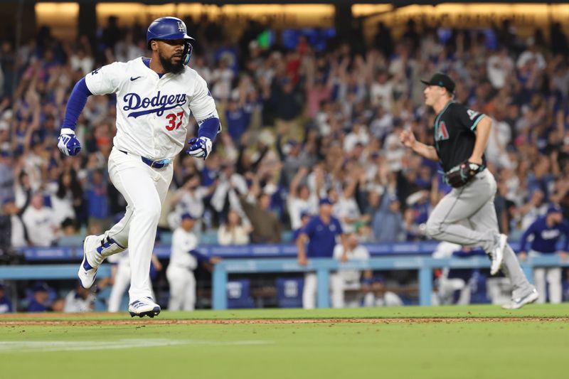 Jul 2, 2024; Los Angeles, California, USA;  Los Angeles Dodgers left fielder Teoscar Hernandez (37) hits a walk off hit from Arizona Diamondbacks relief pitcher Paul Sewald (38) to defeat the Diamondbacks  in bottom of the ninth inning at Dodger Stadium. Mandatory Credit: Kiyoshi Mio-USA TODAY Sports