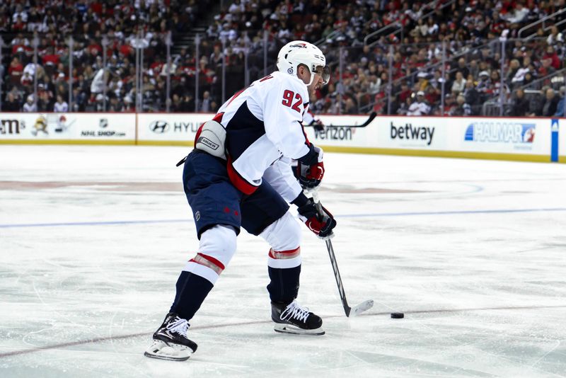 Nov 10, 2023; Newark, New Jersey, USA; Washington Capitals center Evgeny Kuznetsov (92) skates with the puck against the New Jersey Devils during the first period at Prudential Center. Mandatory Credit: John Jones-USA TODAY Sports