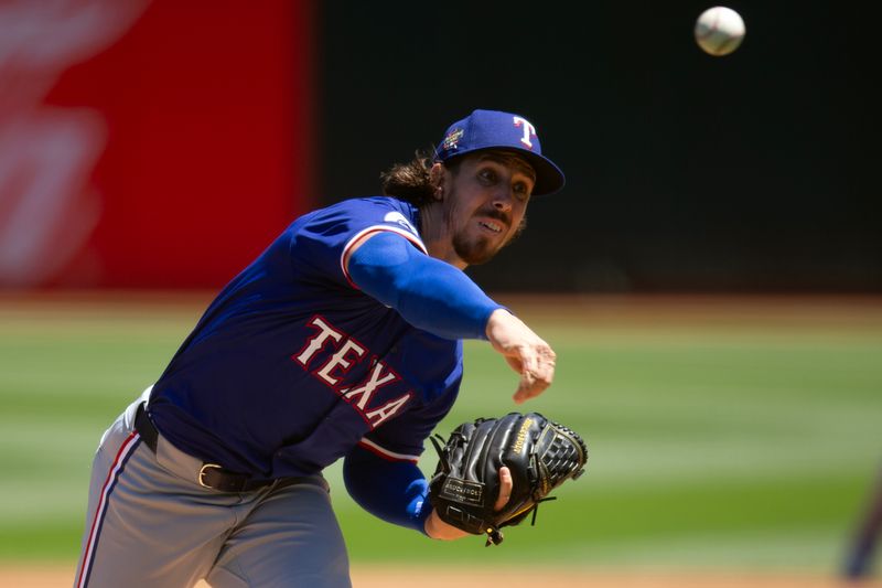 May 8, 2024; Oakland, California, USA; Texas Rangers starting pitcher Michael Lorenzen (23) delivers a pitch against the Oakland Athletics during the first inning at Oakland-Alameda County Coliseum. Mandatory Credit: D. Ross Cameron-USA TODAY Sports