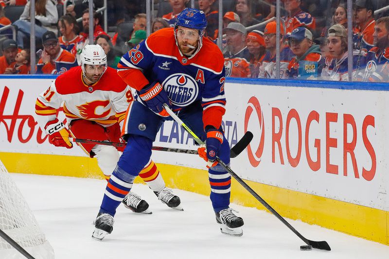 Oct 13, 2024; Edmonton, Alberta, CAN; Edmonton Oilers forward Leon Draisaitl (29) looks to make a pass in front of Calgary Flames forward Name Kadri (91) during the first period at Rogers Place. Mandatory Credit: Perry Nelson-Imagn Images