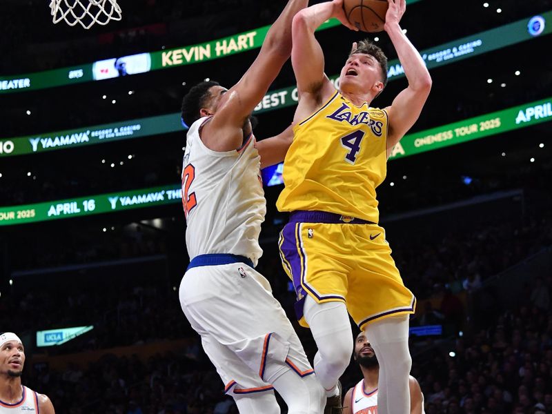 LOS ANGELES, CA - MARCH 6:  Dalton Knecht #4 of the Los Angeles Lakers drives to the basket during the game against the New York Knicks on March 6, 2025 at Crypto.Com Arena in Los Angeles, California. NOTE TO USER: User expressly acknowledges and agrees that, by downloading and/or using this Photograph, user is consenting to the terms and conditions of the Getty Images License Agreement. Mandatory Copyright Notice: Copyright 2025 NBAE (Photo by Juan Ocampo/NBAE via Getty Images)