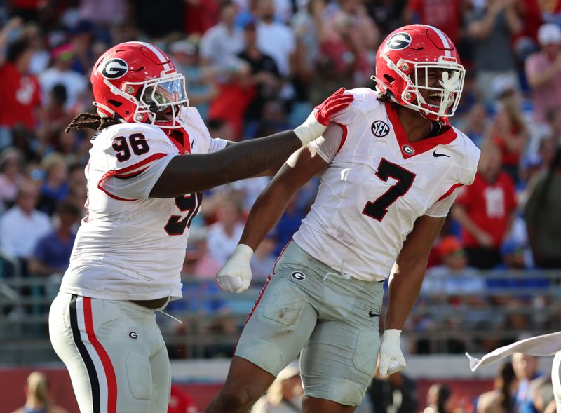 Oct 28, 2023; Jacksonville, Florida, USA; Georgia Bulldogs linebacker Marvin Jones Jr. (7) celebrates after recovering a fumble against the Florida Gators during the first half at EverBank Stadium. Mandatory Credit: Kim Klement Neitzel-USA TODAY Sports