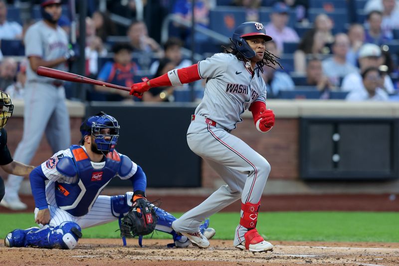 Jun 10, 2025; New York City, New York, USA; Washington Nationals shortstop CJ Abrams (5) follows through on an RBI double against the New York Mets during the second inning at Citi Field. Mandatory Credit: Brad Penner-Imagn Images