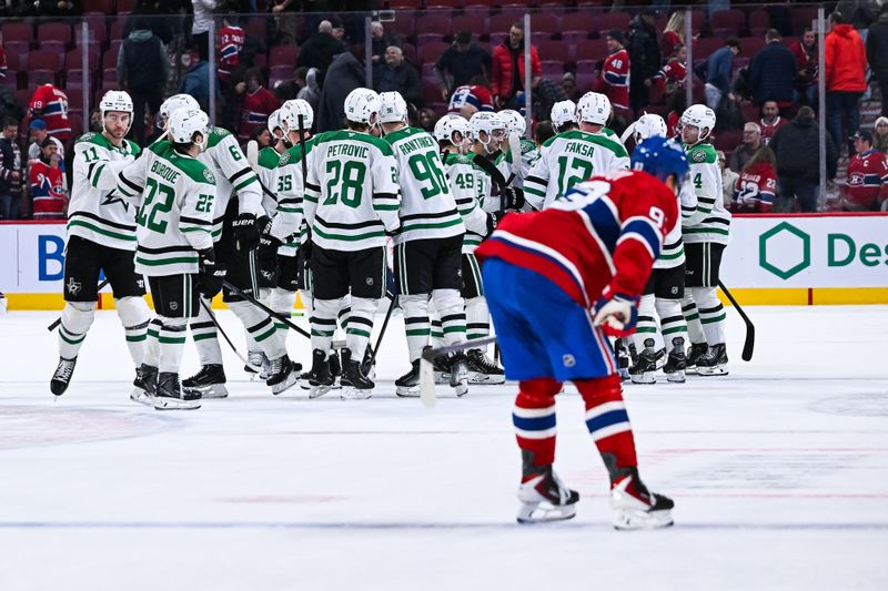 Nov 13, 2025; Montreal, Quebec, CAN; Dallas Stars players gather together to celebrate their win against the Montreal Canadiens after the third period at Bell Centre. Mandatory Credit: David Kirouac-Imagn Images